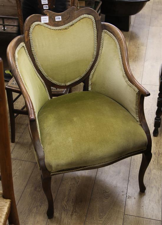 A Victorian mahogany armchair, with shaped back